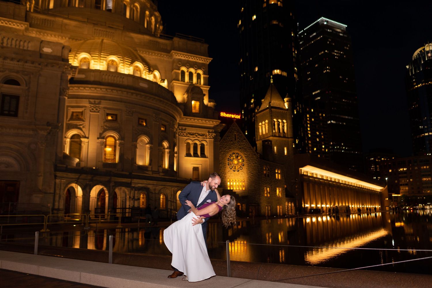Luxury Engagement Portraits in Boston, MA with Leah Ramuglia Photography. Reflections of the Christian Science Center Plaza at night.