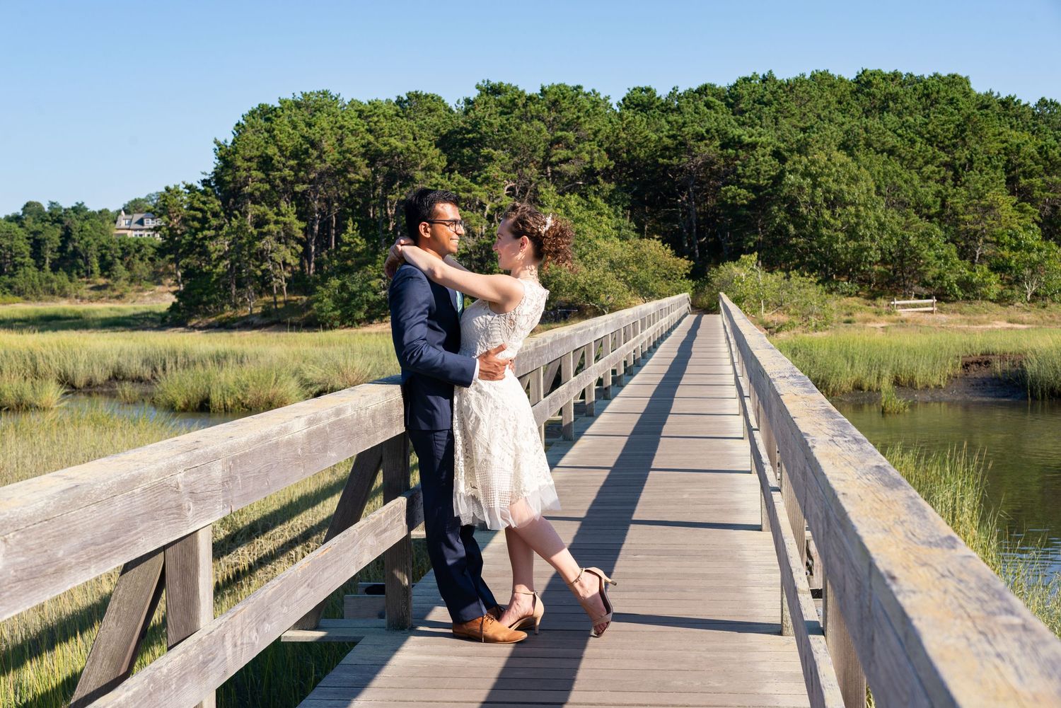 Couples wedding portraits on Uncle Tim’s Bridge in Wellfleet on Cape Cod’s National Seashore.  First look was photographed by Leah Ramuglia
