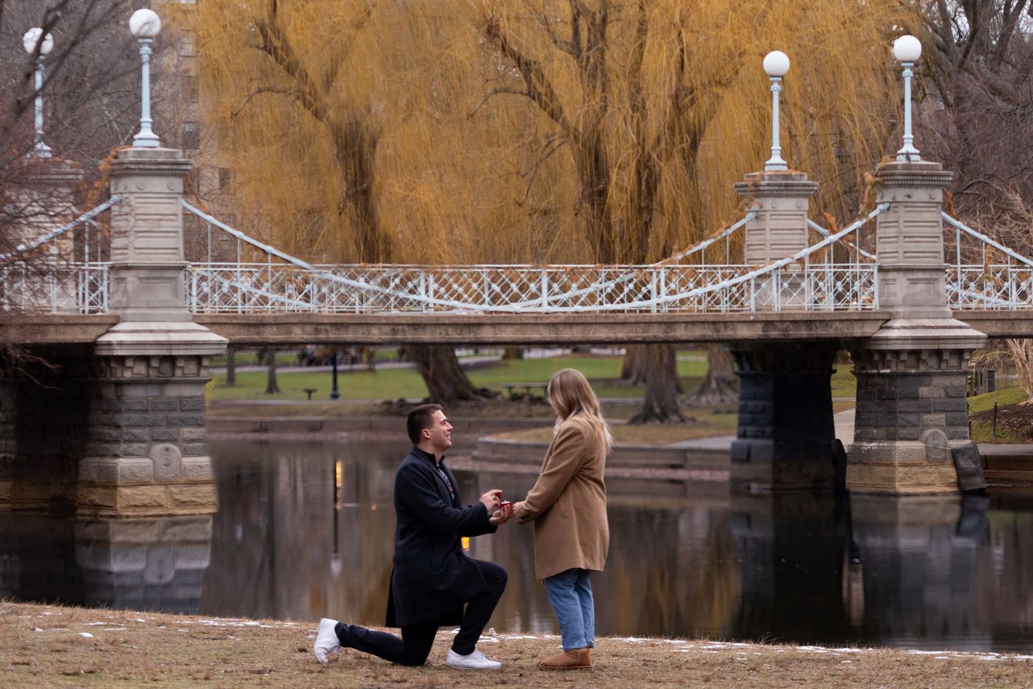 Marriage proposal during fall foliage in Boston’s Public Garden photographed by Leah Ramuglia.