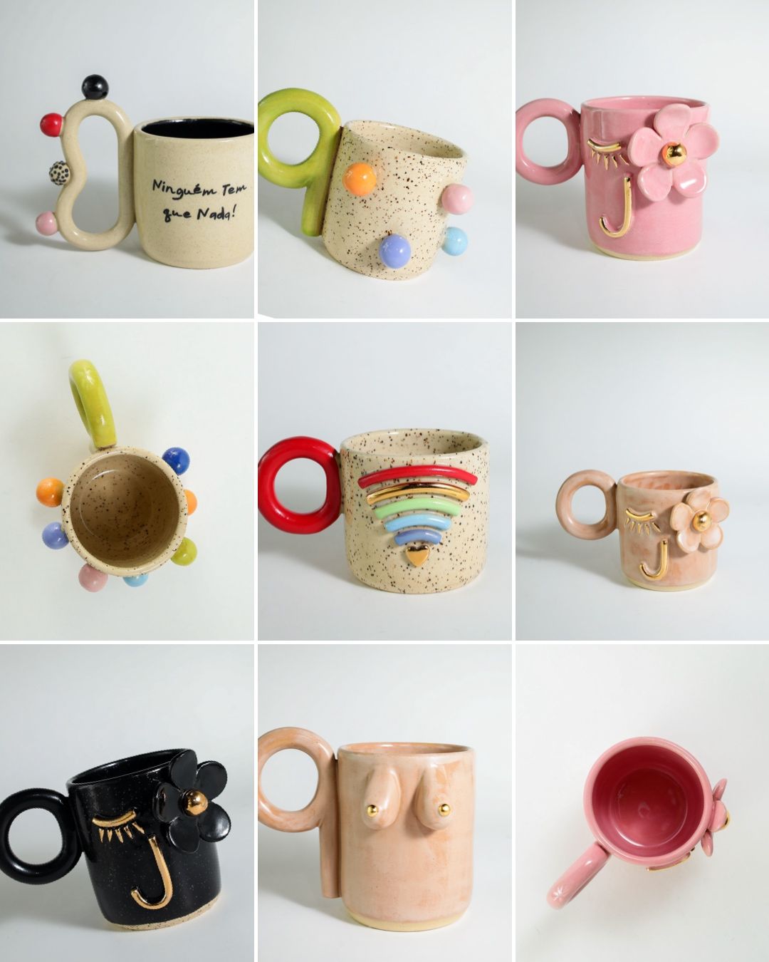Collection of handmade ceramic mugs featuring whimsical designs with pom poms, rainbows, and floral decorations in pastel colors.