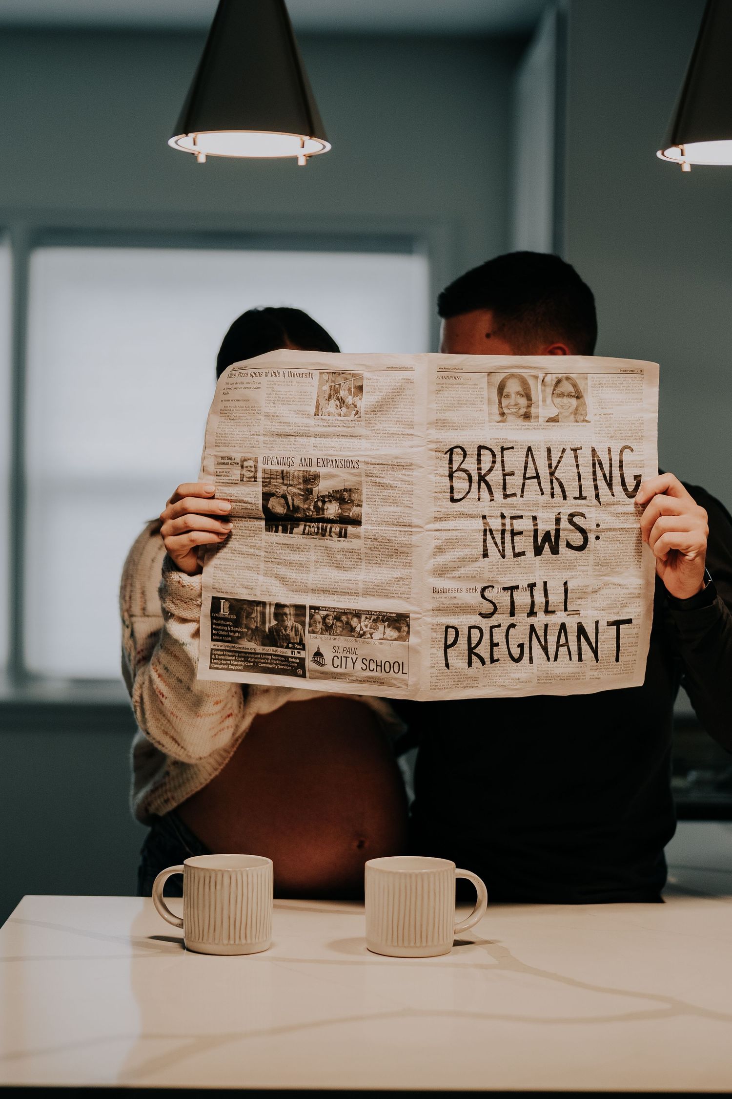 A creative pregnancy announcement series showing a newspaper being unfolded to reveal 'Breaking News: Still Pregnant'.