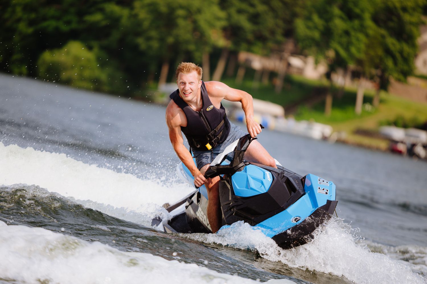 Series of action shots showing wakeboarding maneuvers on a lake.