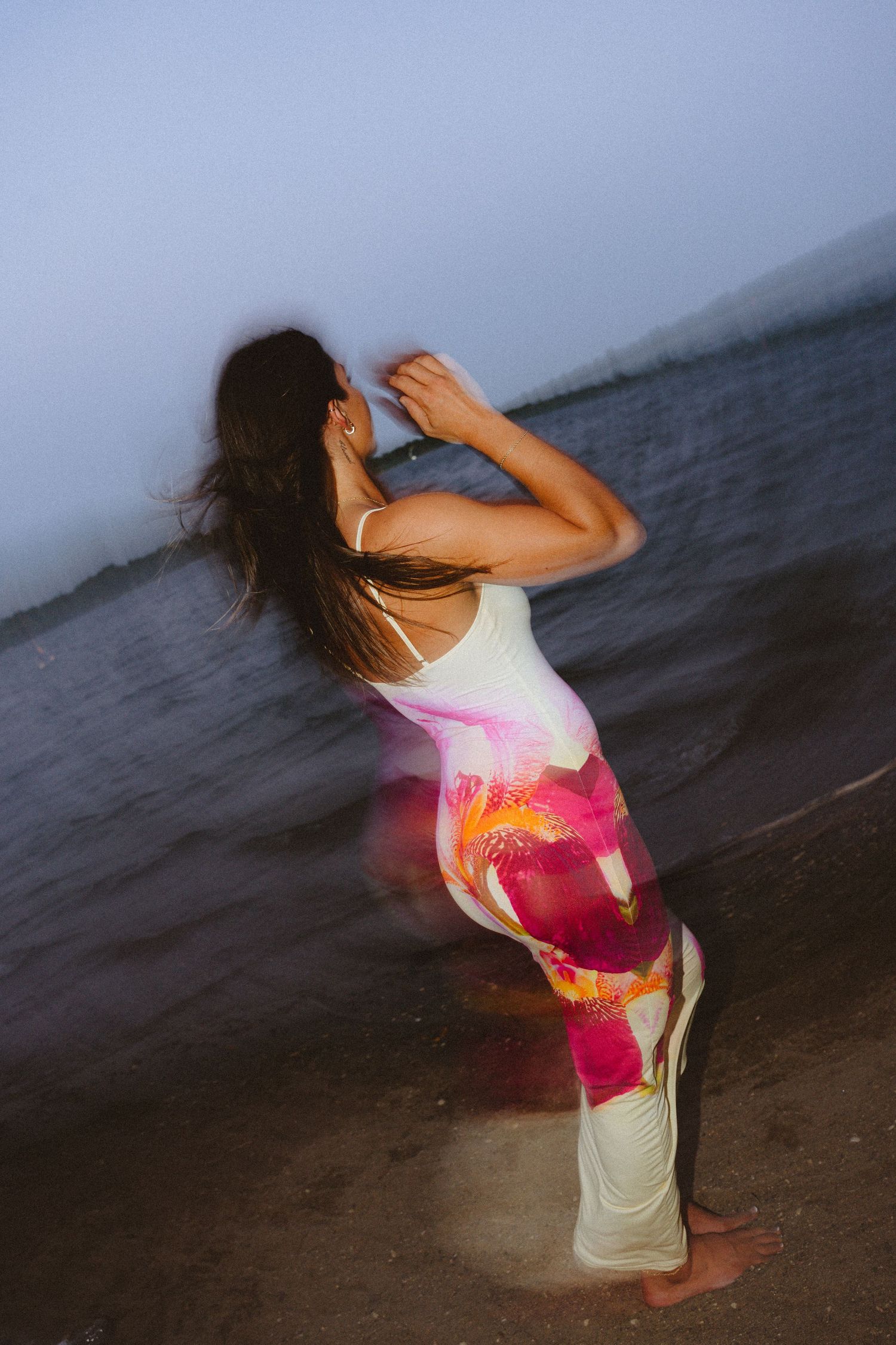 A series of dance poses captured in motion against a moody beach backdrop at dusk.