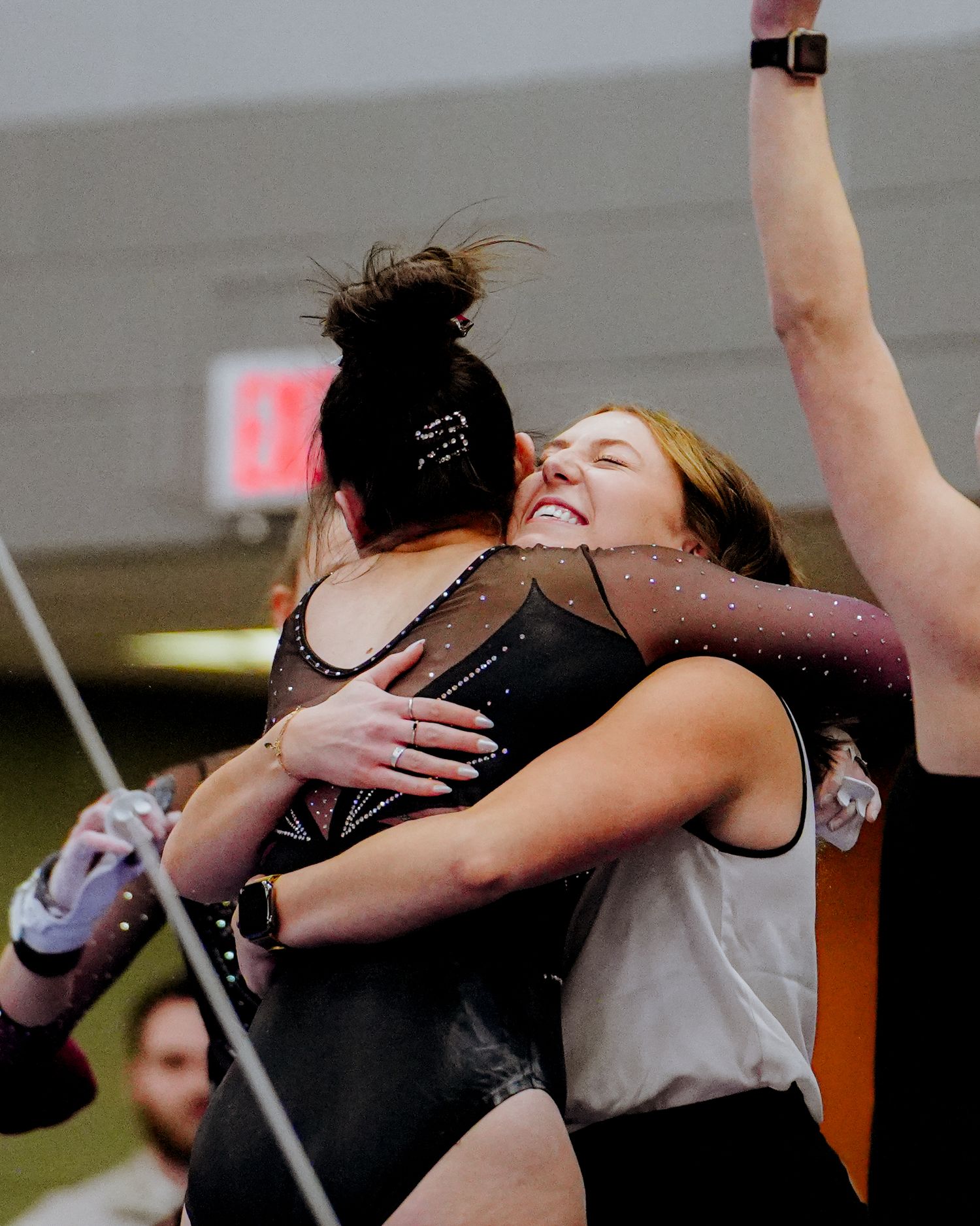 Two dancers perform a passionate embrace during a contemporary dance performance on stage.