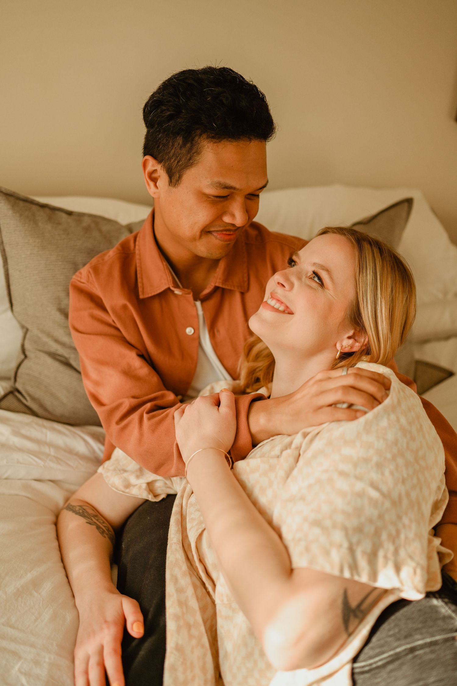 An intimate moment shared between a couple on a cozy couch.
