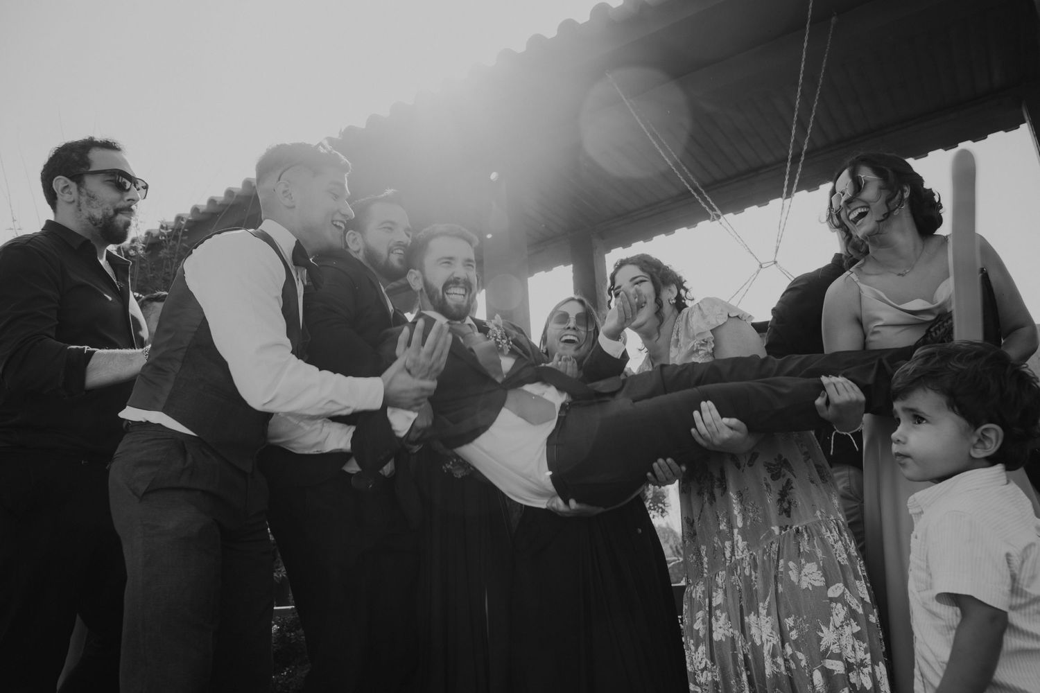 A nostalgic black and white scene of people gathered in celebration.