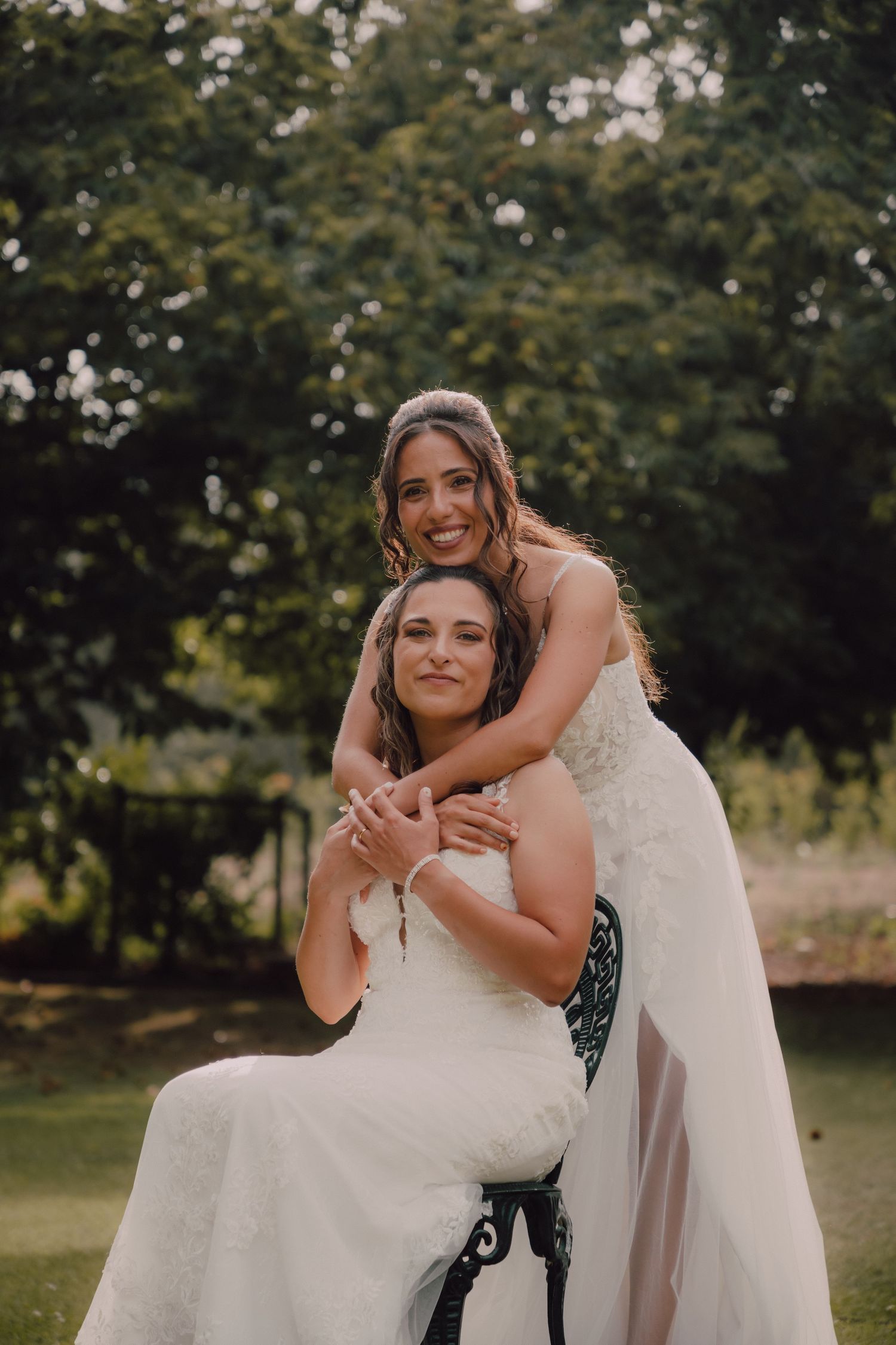 Special moment shared between wedding couple embracing outdoors.