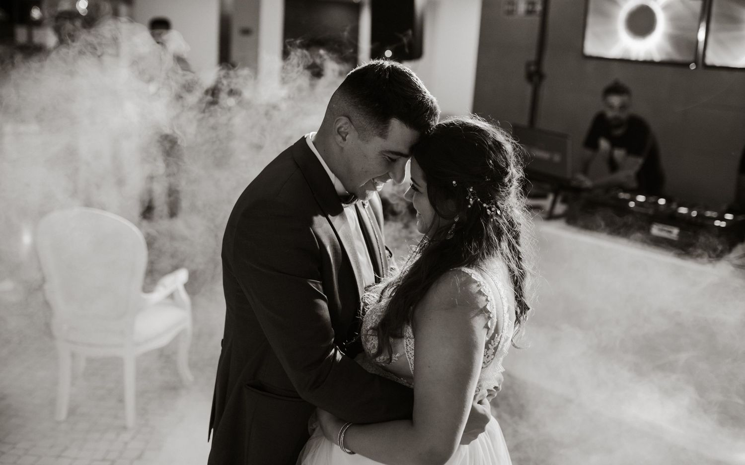 A romantic black and white first dance moment captured between newlyweds on their wedding day.