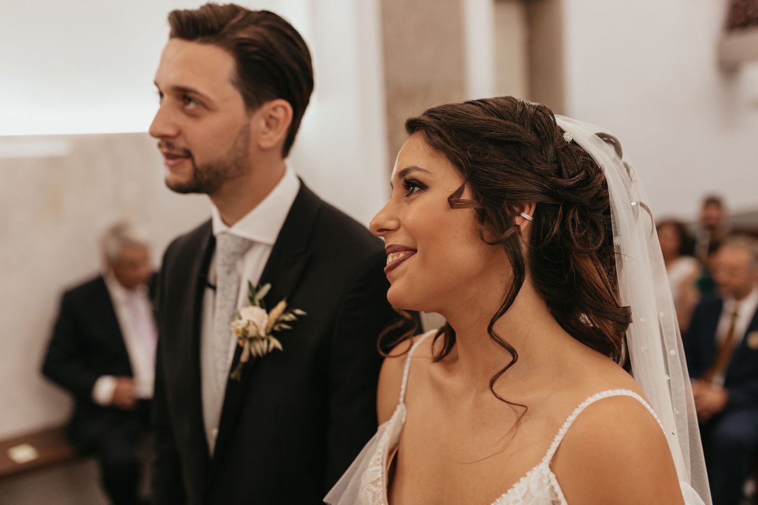 Joyful ceremony moment in bright church interior.