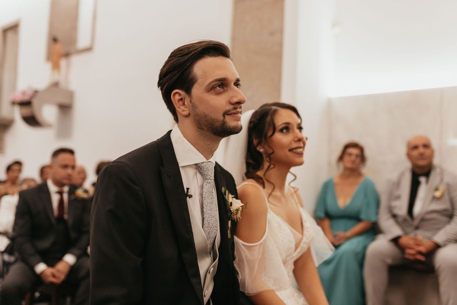 Traditional church wedding ceremony with guests in attendance.