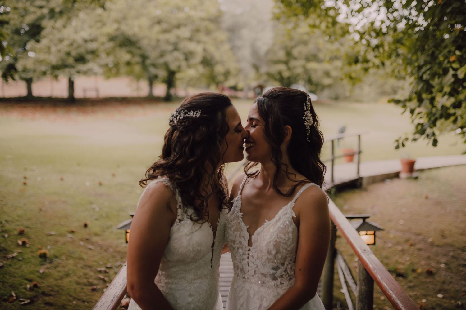 Intimate wedding moment captured in natural outdoor setting.