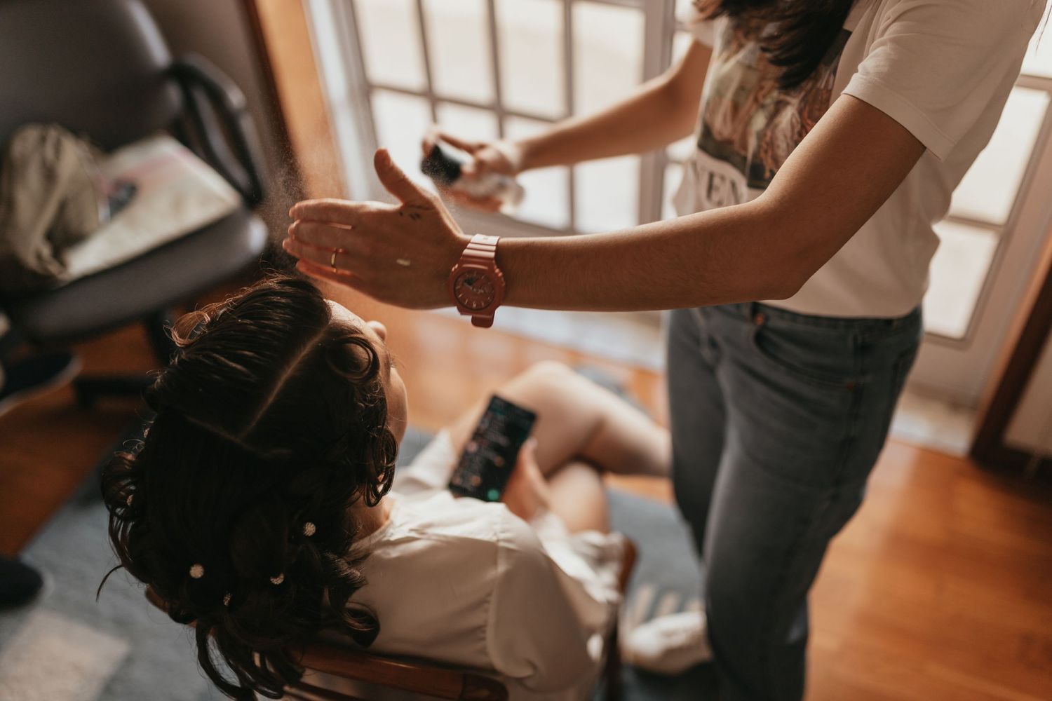 Behind-the-scenes preparation shot showing wedding day styling and pampering.