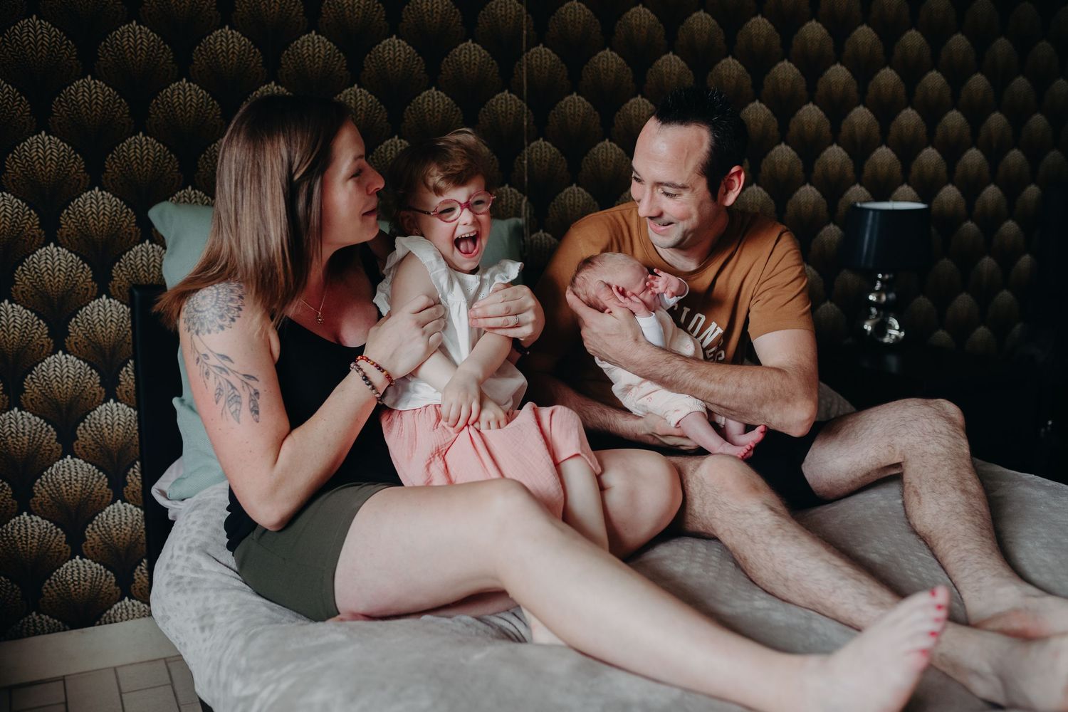 A sequence of intimate lifestyle photos showing people relaxing together on a bed.