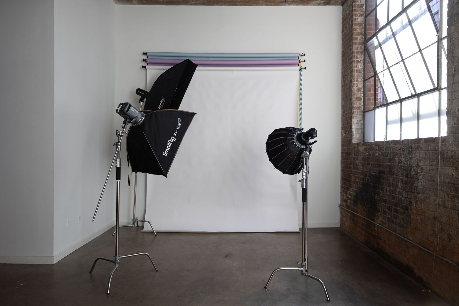 Photography studio setup with backdrop and professional lighting equipment for portraits and brand shoots