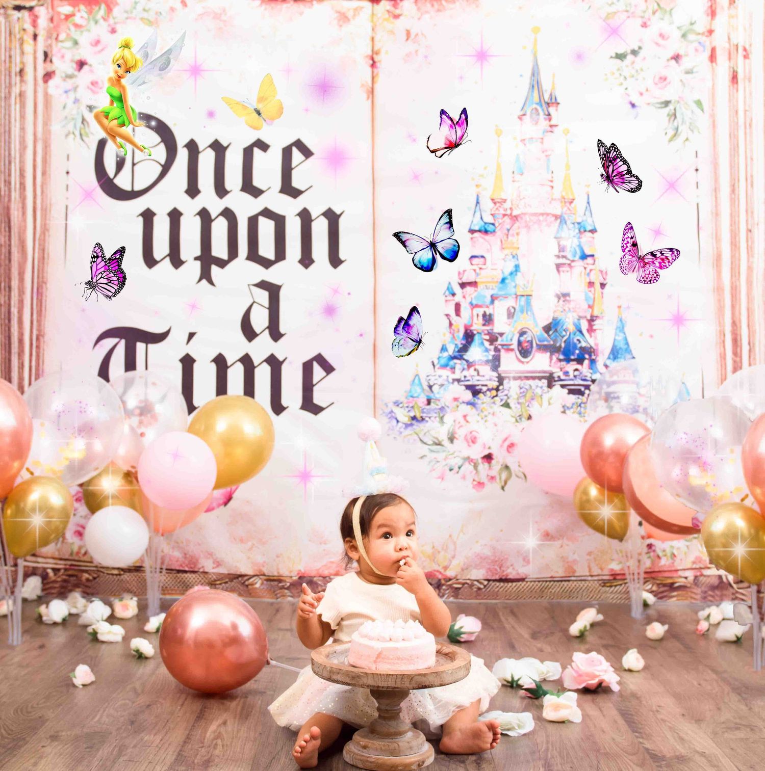 Whimsical princess-themed photo setup for cake smash with 'Once Upon a Time' text, castle backdrop in Smithfield, NC taken by Krystie Nicole