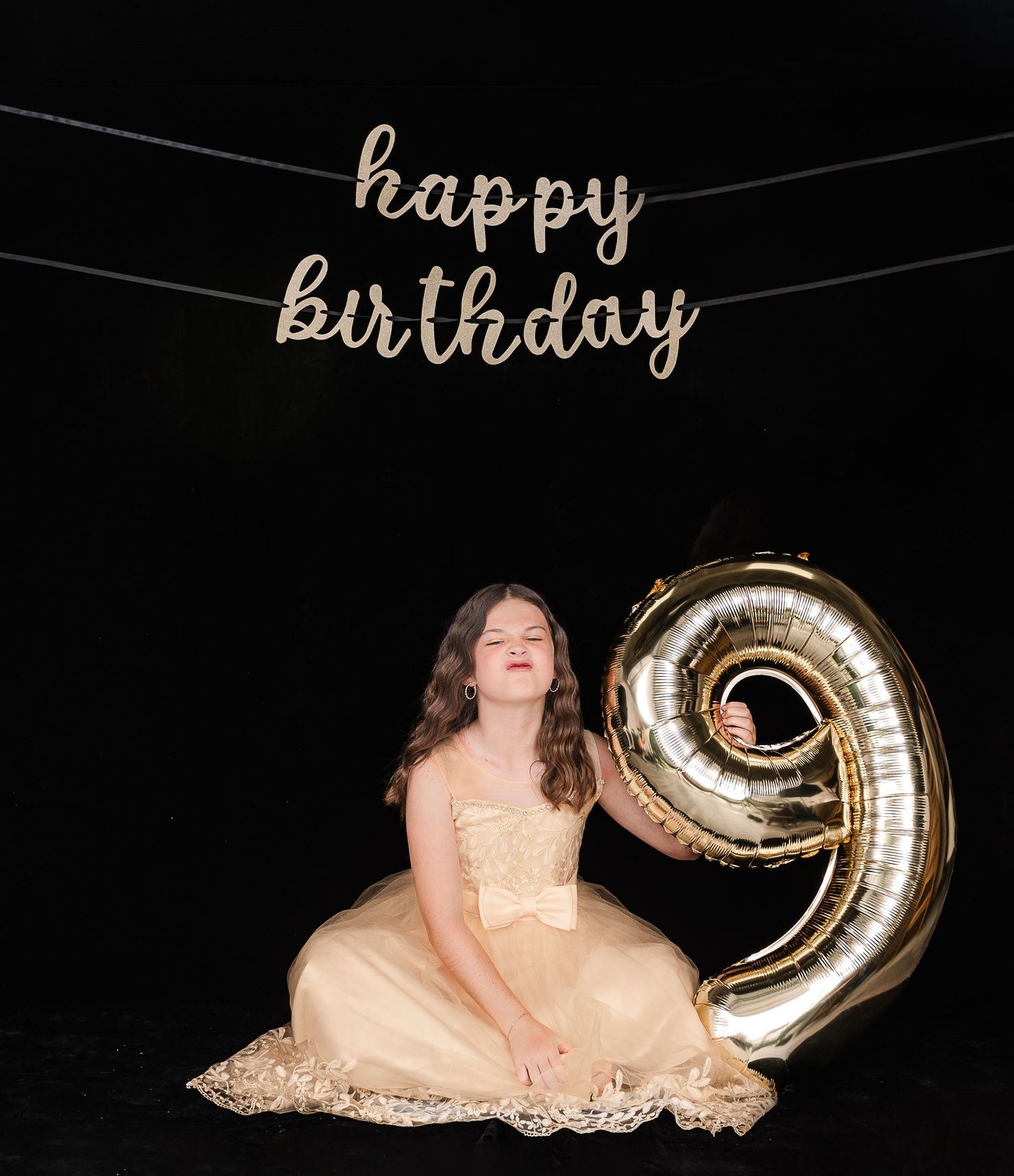 Gold sparkly birthday scene with 'happy birthday' text and large metallic number 9 balloon against dark background.