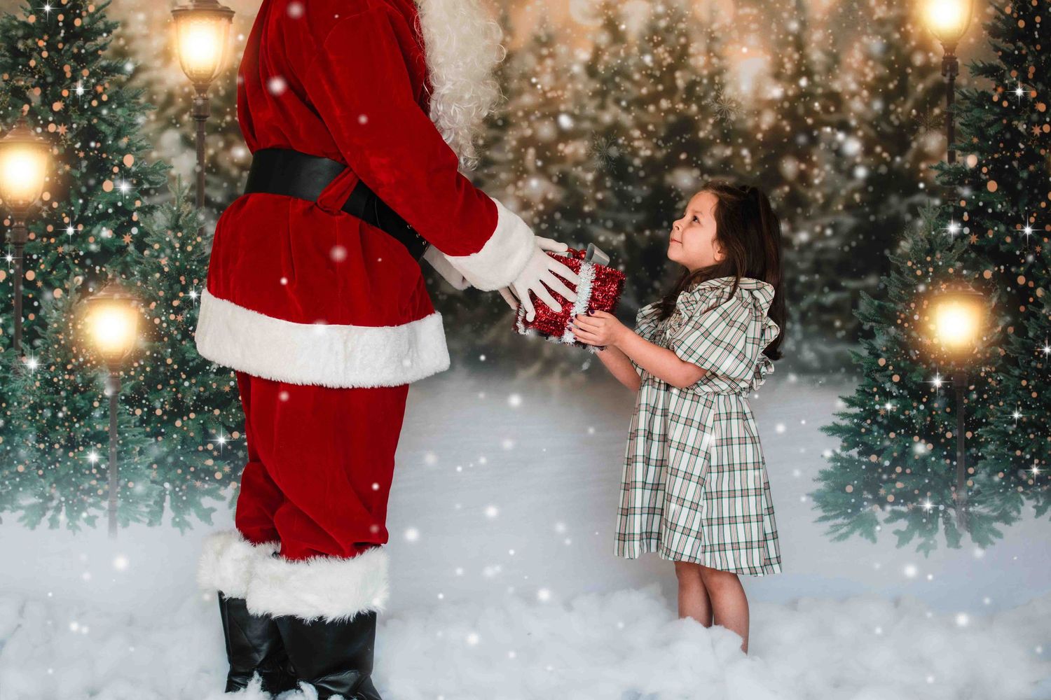 A magical Christmas scene with glowing bokeh lights and snow where a small child receives a special gift.