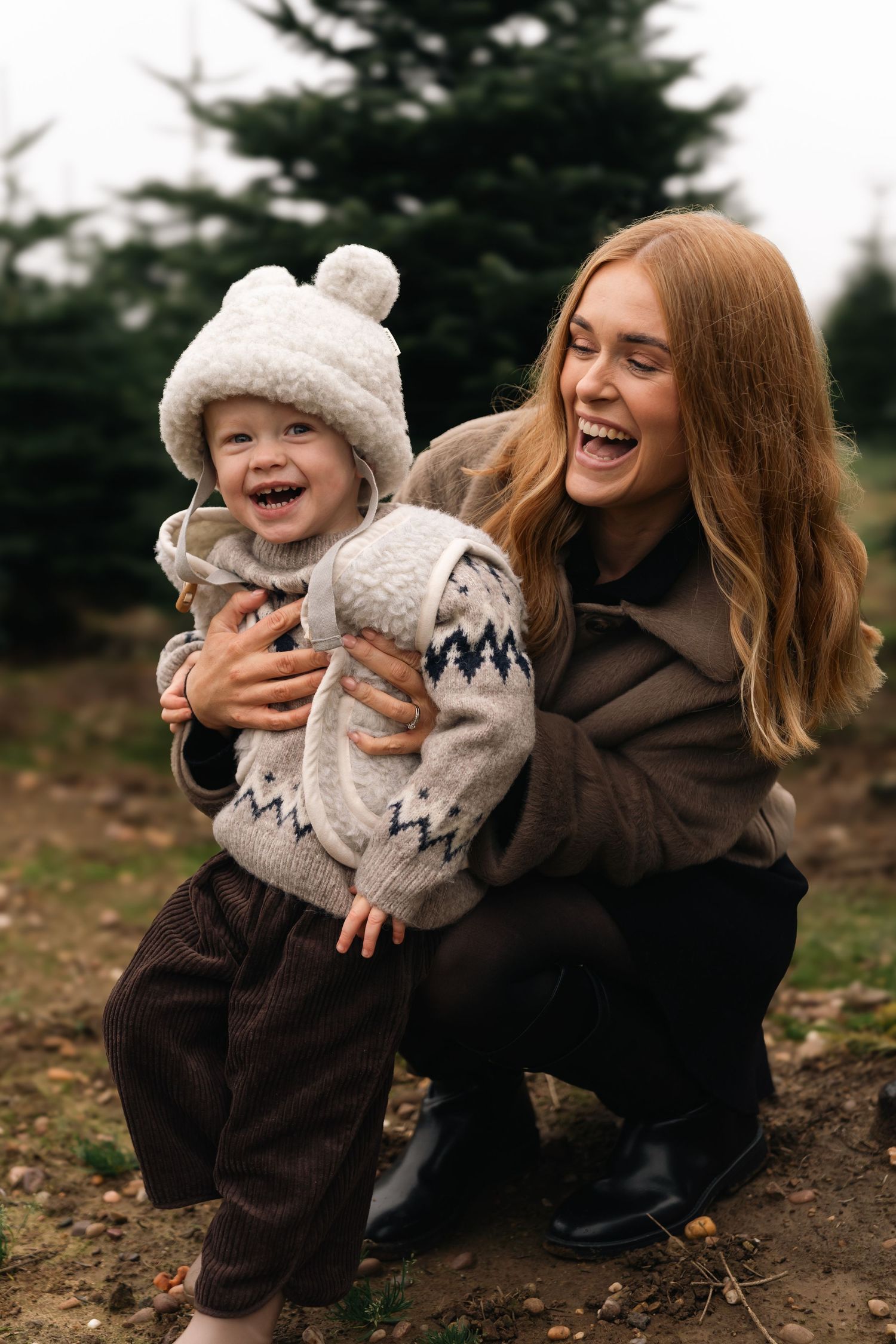 A heartwarming series of candid moments showing playful interaction between a parent and child in winter clothing outdoors.