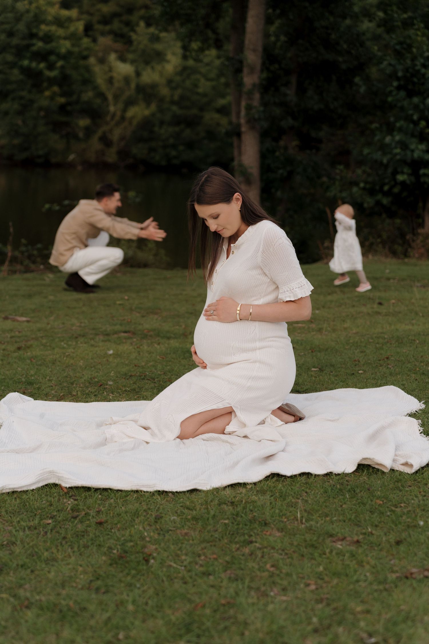 A series of connected photos showing a person in a white dress reclining on a blanket in a grassy outdoor setting.