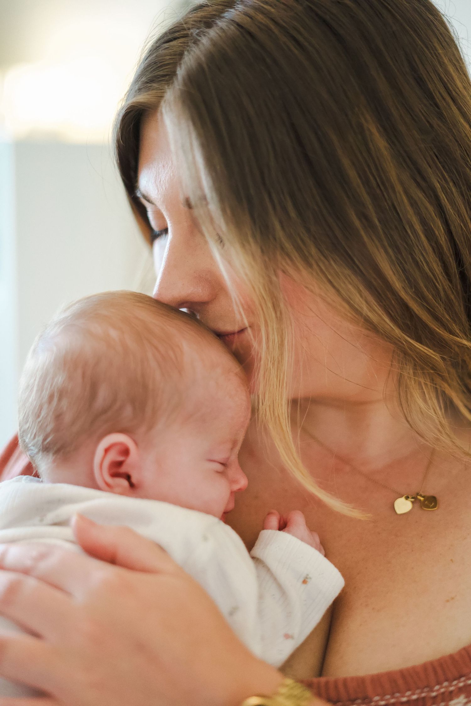 Close-up shots capturing gentle nurturing moments with a baby.