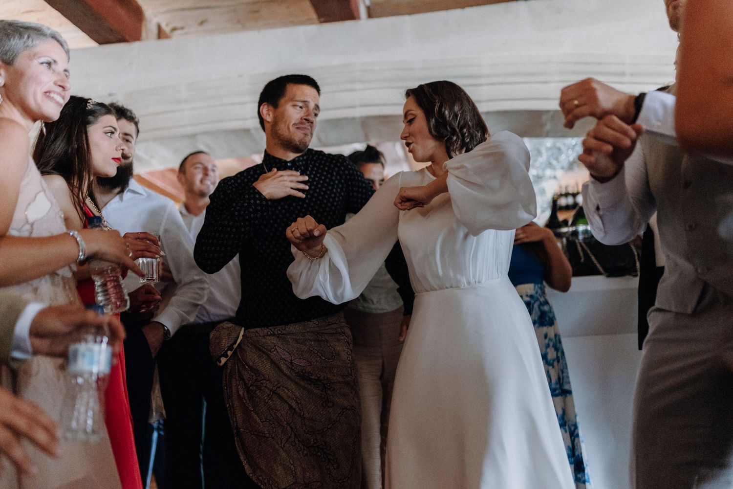 Wedding guests celebrating with champagne and toasts.