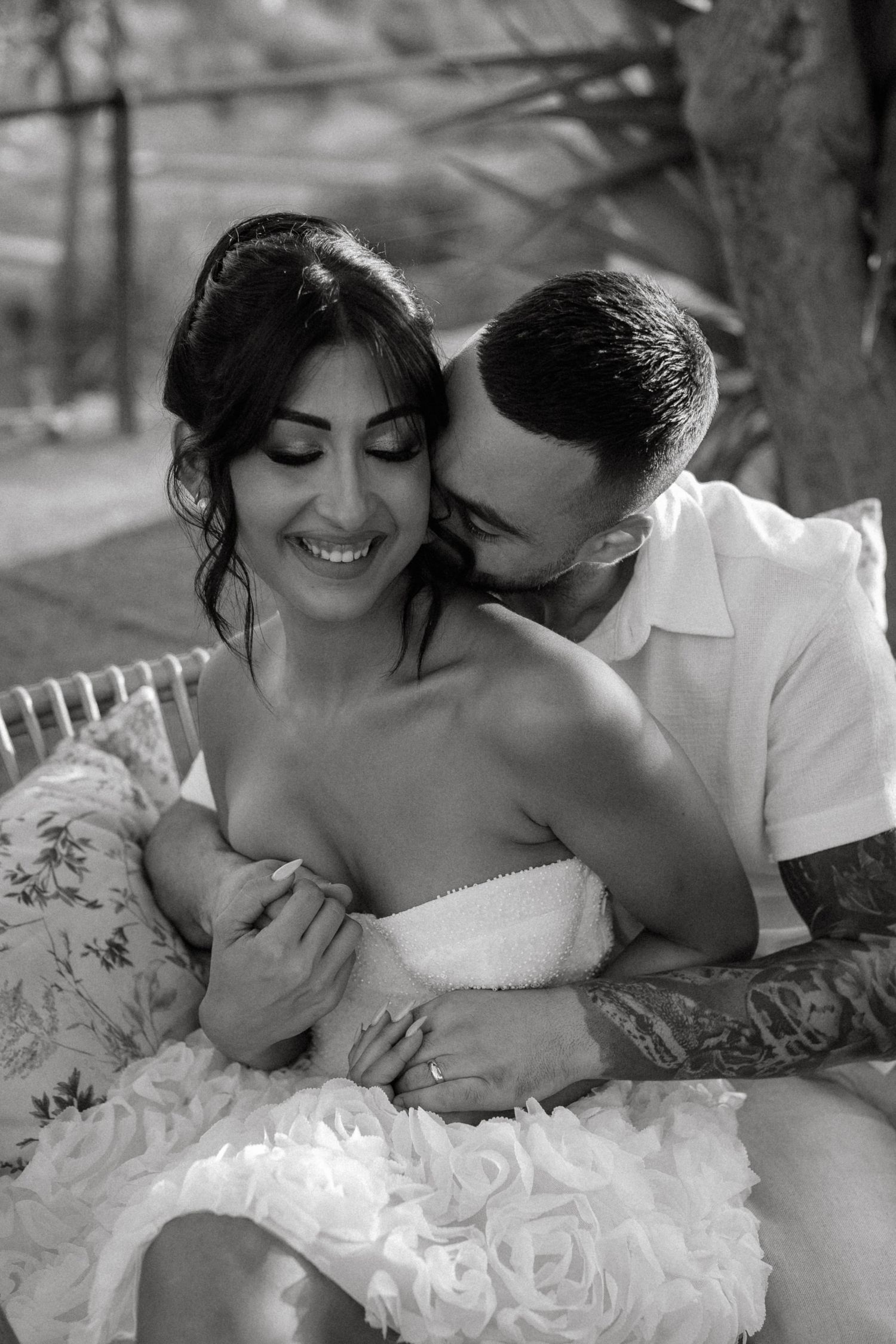 Intimate black and white portraits of newlyweds sharing romantic moments.
