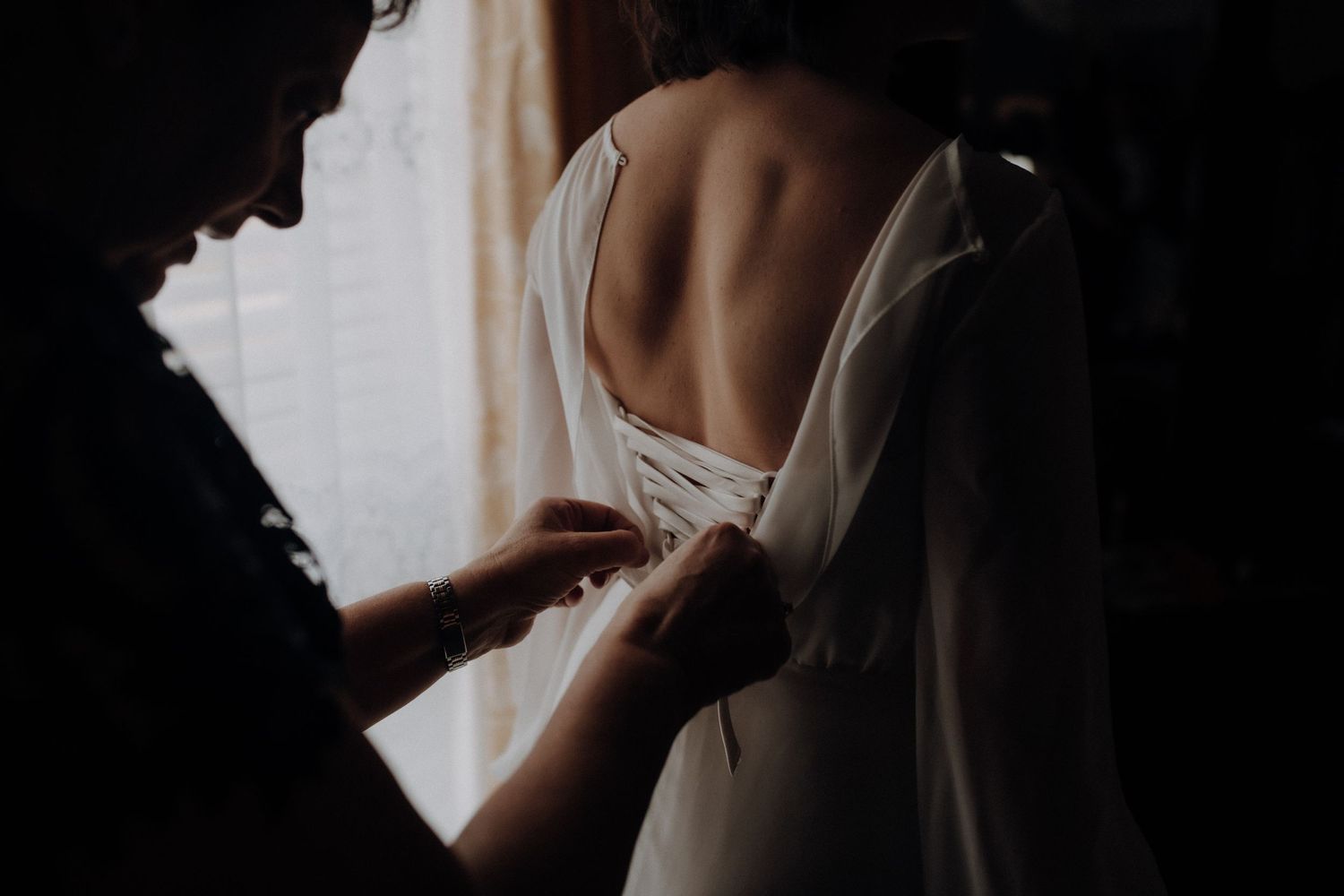 Dark silhouette of a couple creating dramatic shadows in a moody lighting setup.