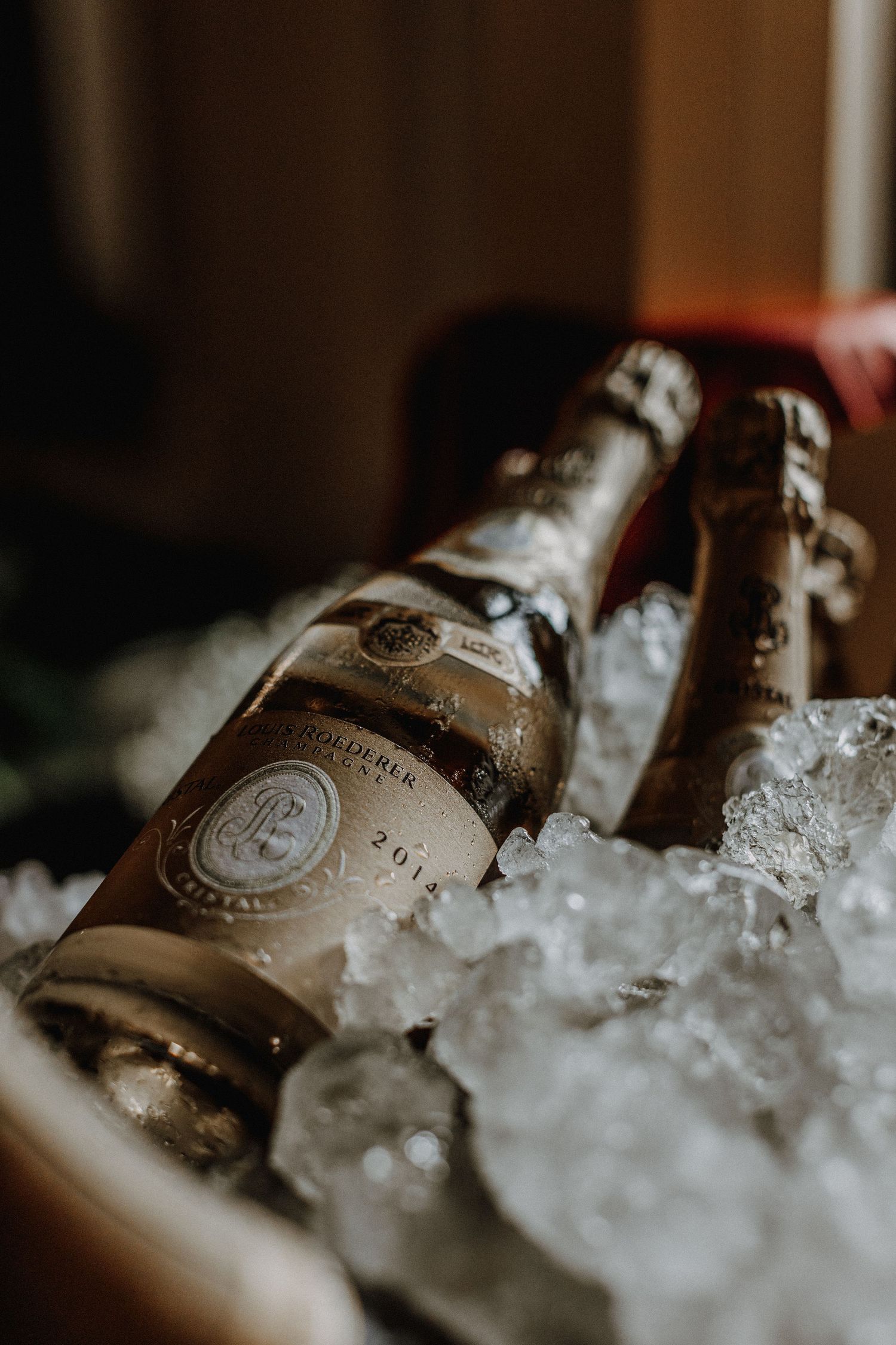 Champagne bottles chilling in ice at an elegant celebration.