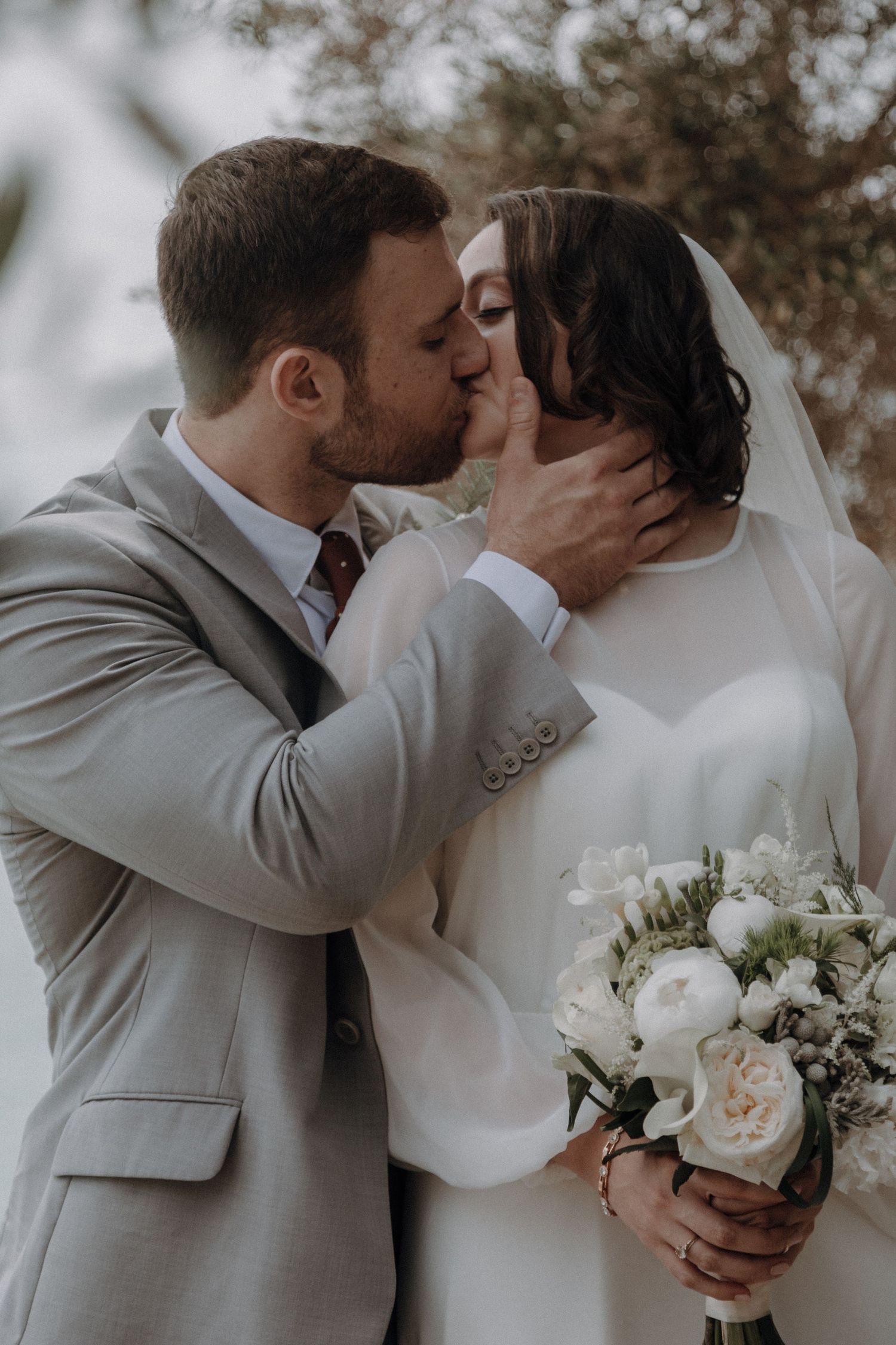 Romantic wedding photography sequence capturing tender kisses and embraces.