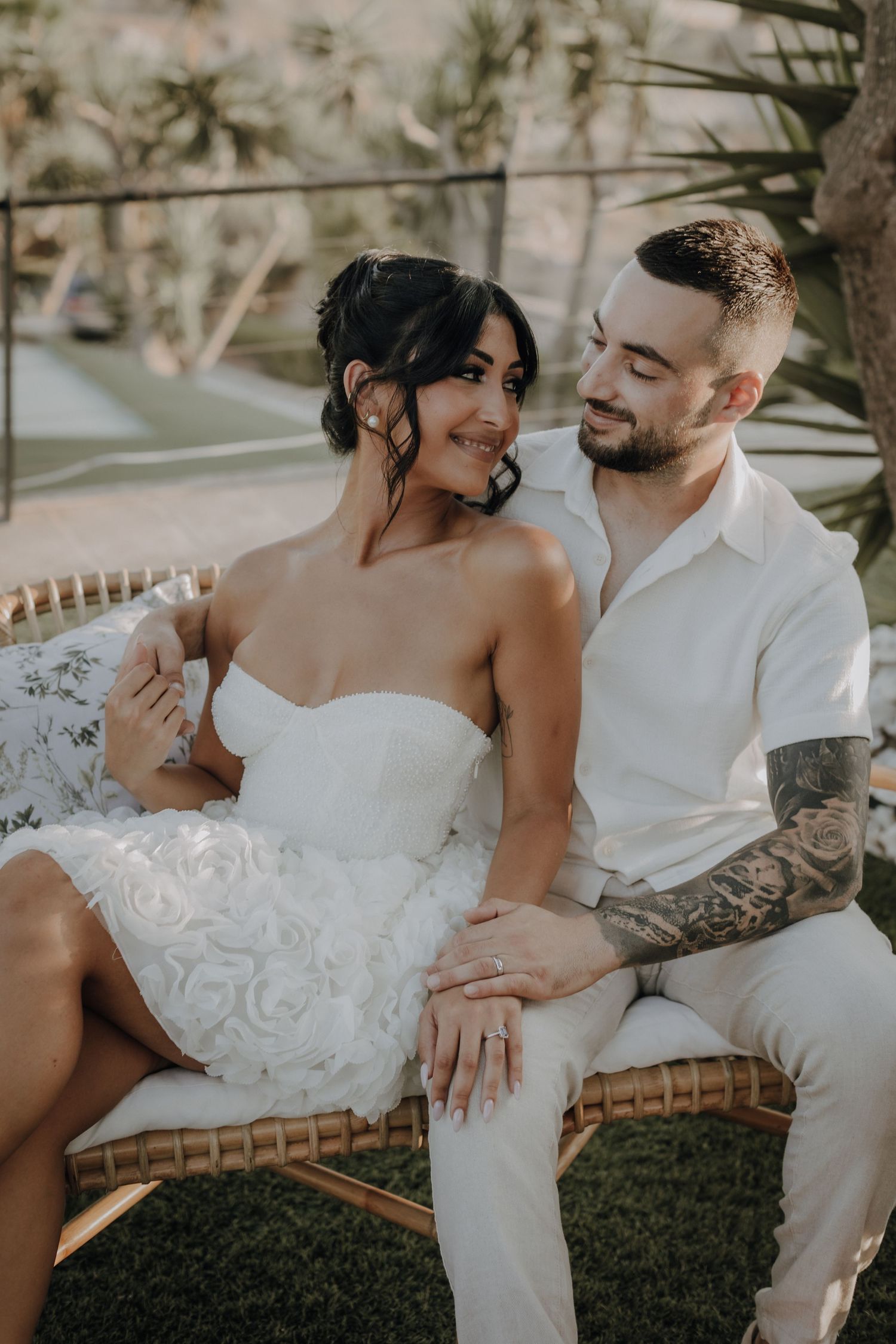 Intimate wedding portraits captured in a dreamy outdoor garden setting.
