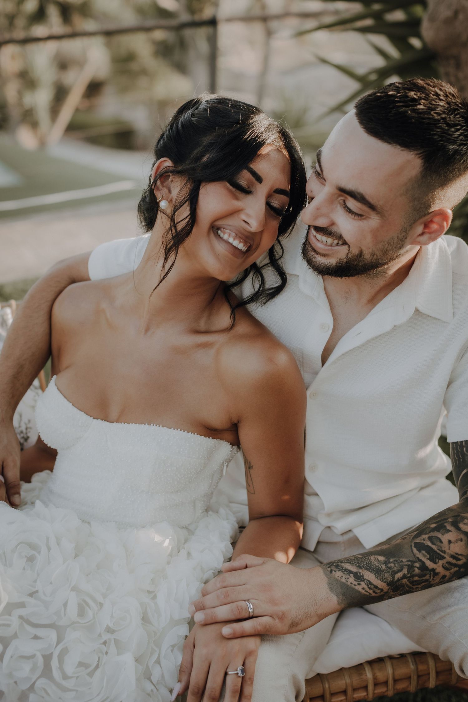 A romantic wedding photoshoot with intimate close-up shots of a couple in white attire.