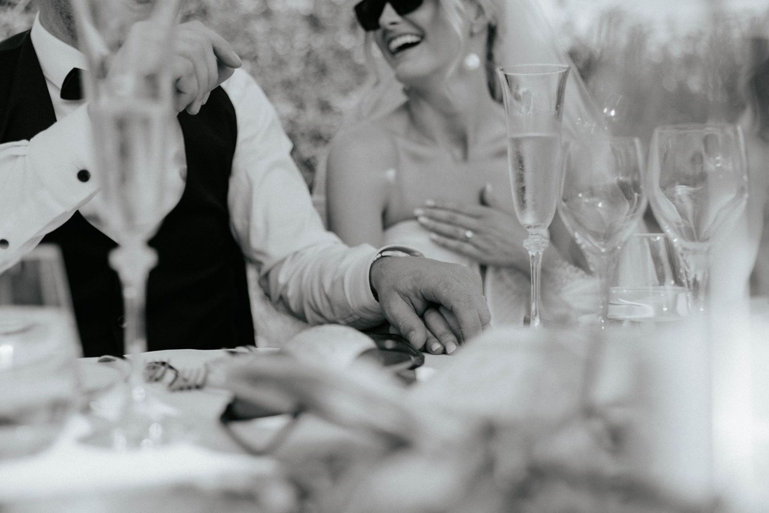 Black and white photo of a wedding reception table with champagne glasses. Monte do Serrinho, Messines, Algarve, Portugal.