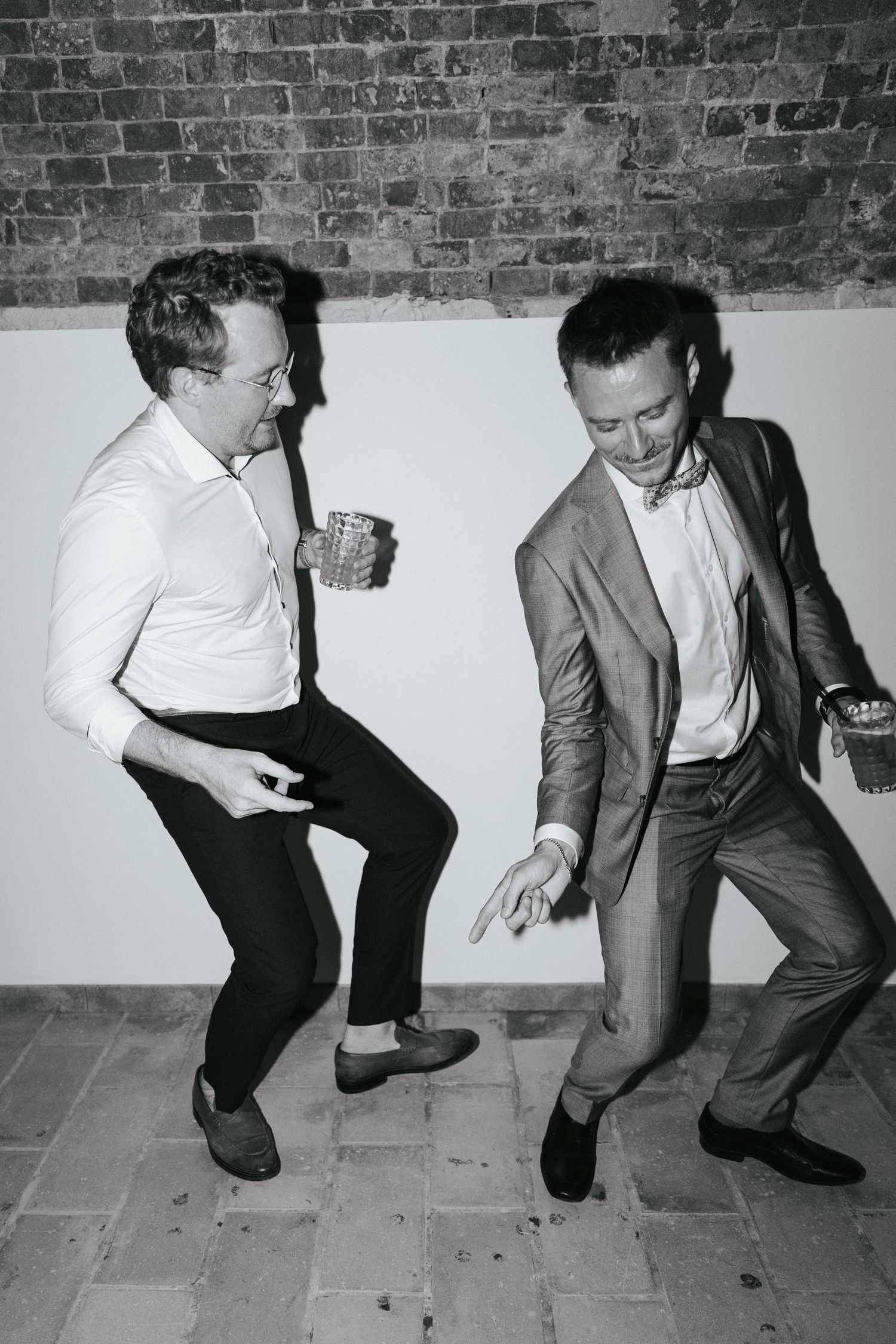 Black and white photos showing people dancing and jumping at a lively party.