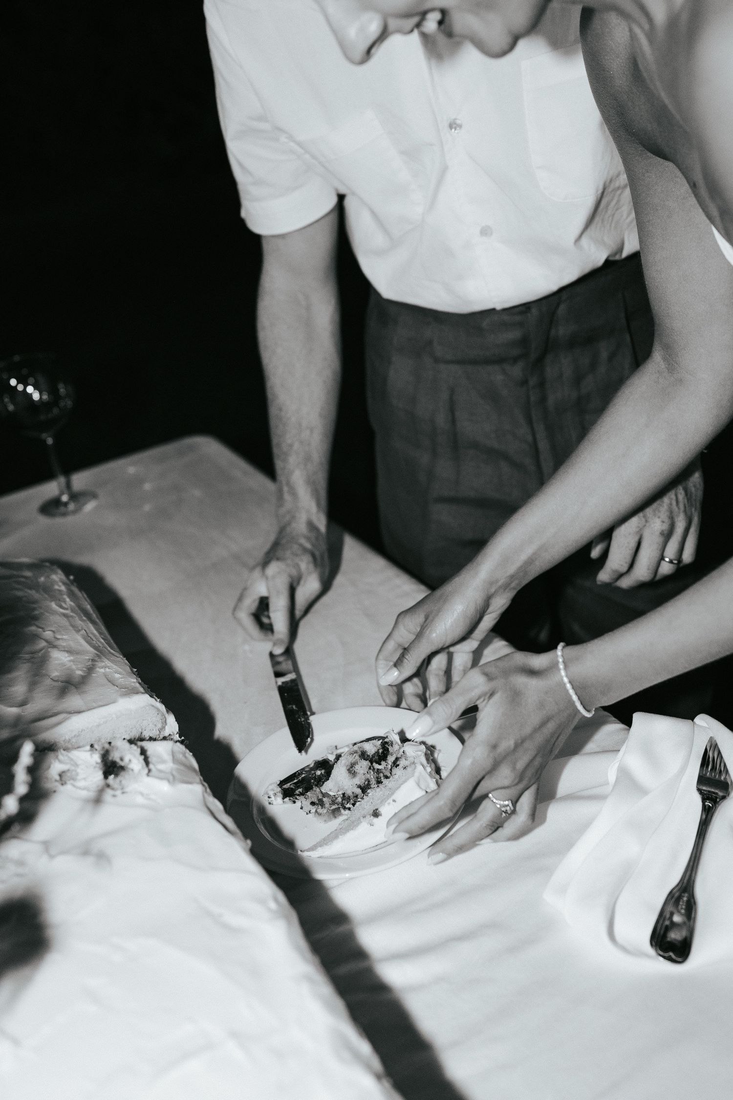 A sequence of black and white photos showing hands cutting and dissecting what appears to be a specimen on white paper.
