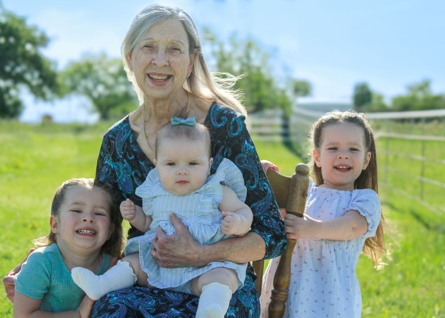 Candid outdoor photo series capturing sweet moments in a grassy field on a bright summer day.