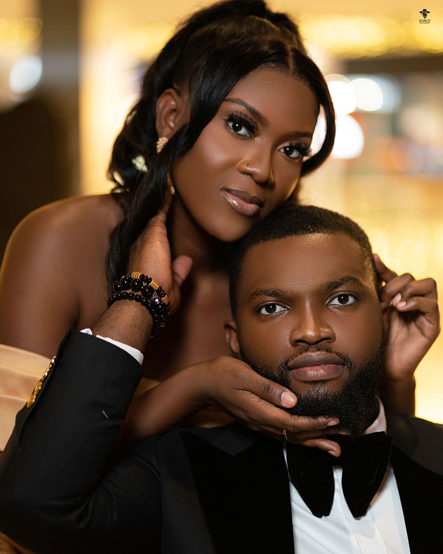Elegant formal portrait with luxurious lighting and sophisticated styling.