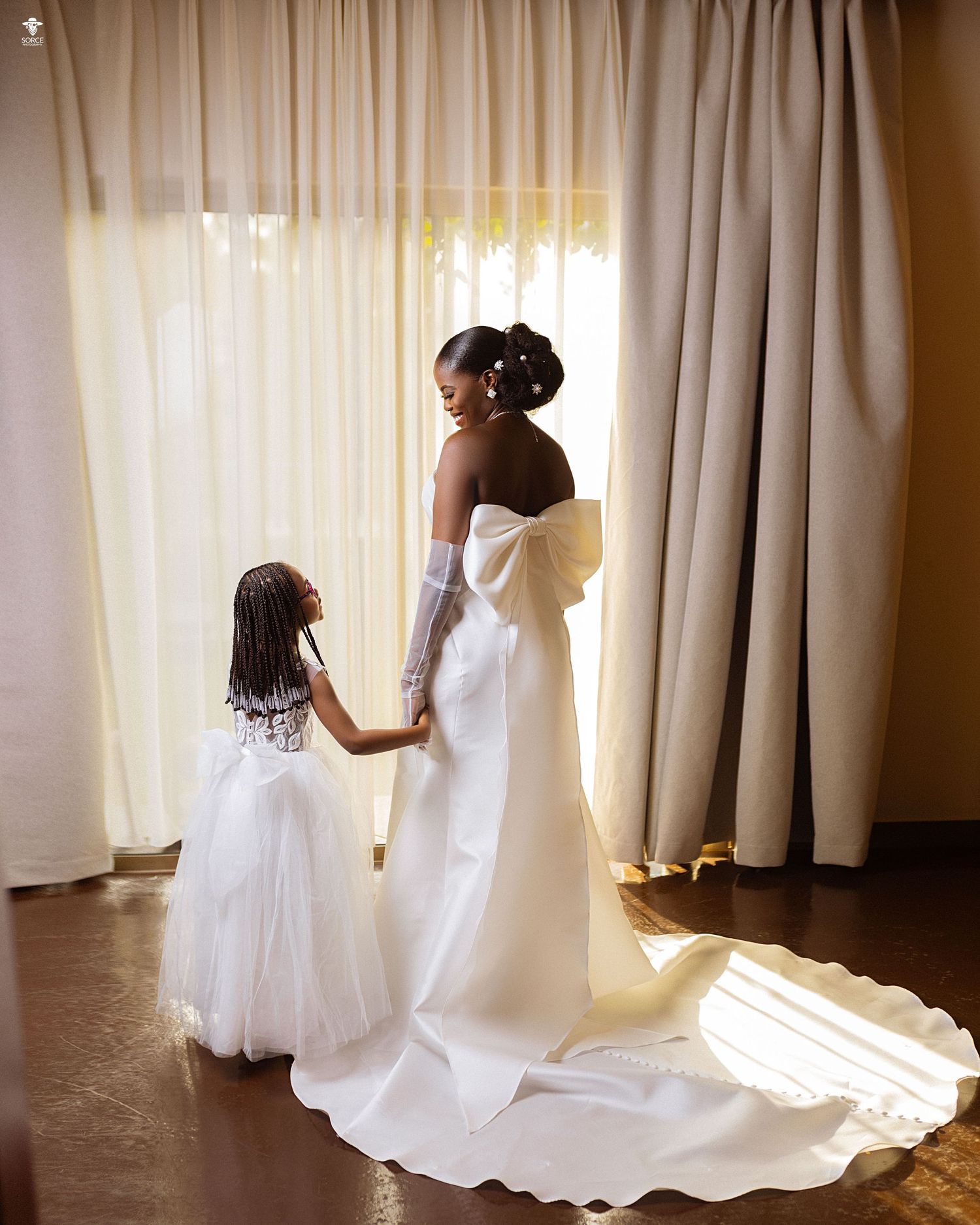 A sequence of four photos shows white bridal gown fabric being adjusted near sunlit curtains in a room.