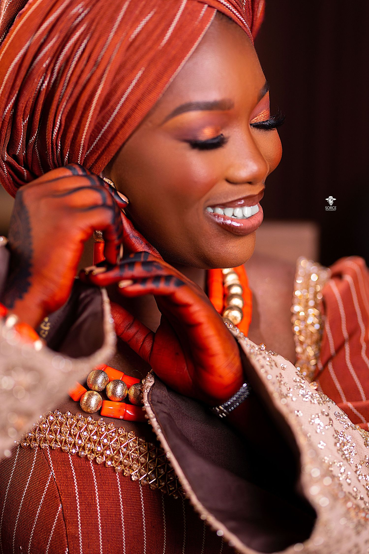 Elegant bridal portraits in warm lighting showing delicate lace details and a stunning gold necklace.