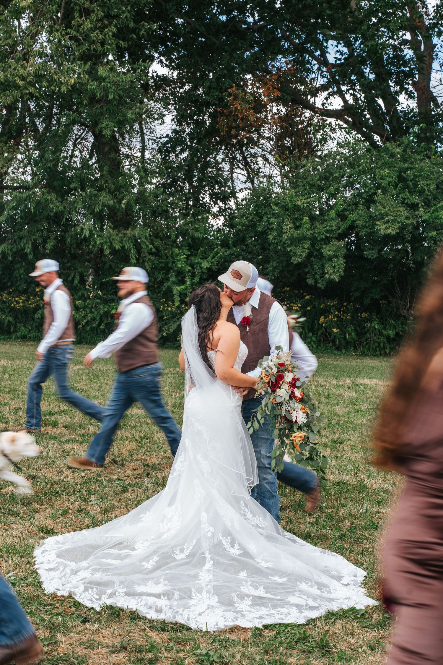 Wedding party members playfully pose in a sequence of action shots in an outdoor garden setting.