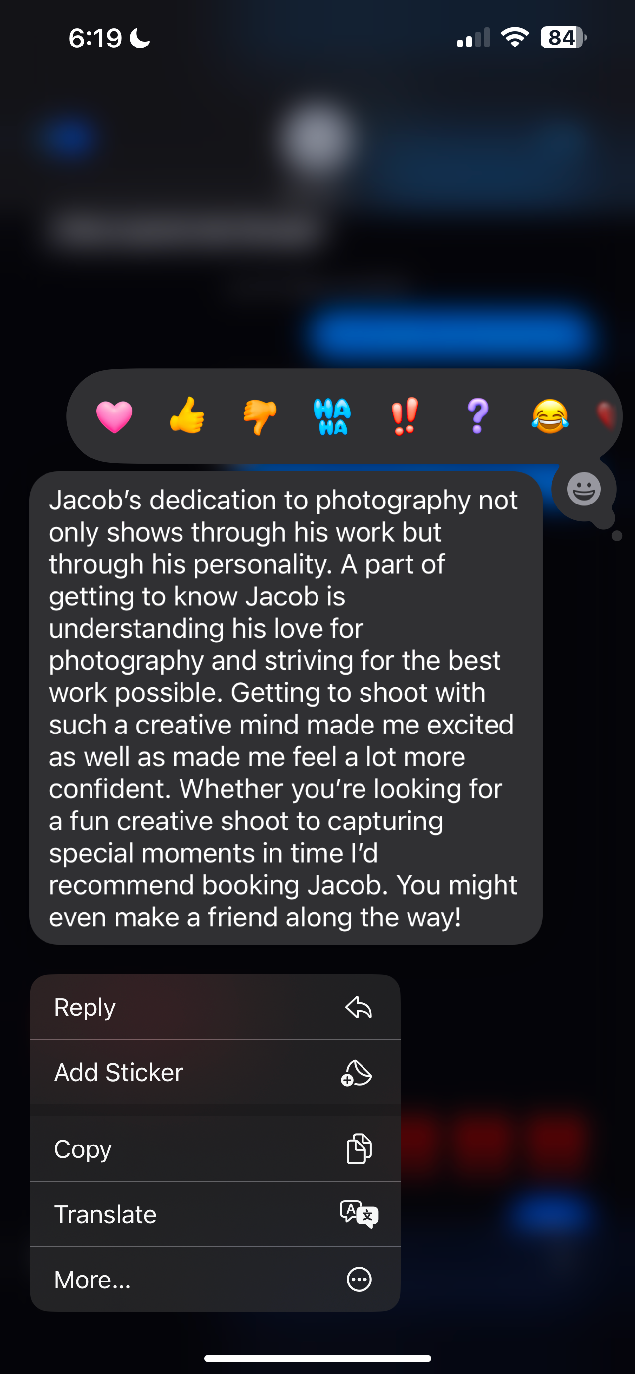 Dark mode screenshot showing text messages about photography with reaction emojis visible at the top of the screen.