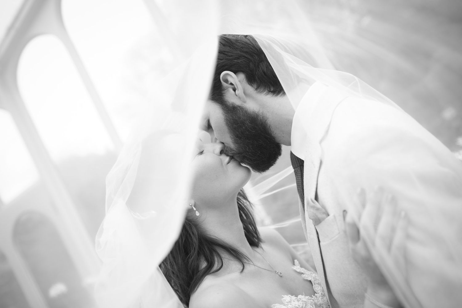 Bride and groom sharing a kiss at Kinsale wedding in Co. Cork