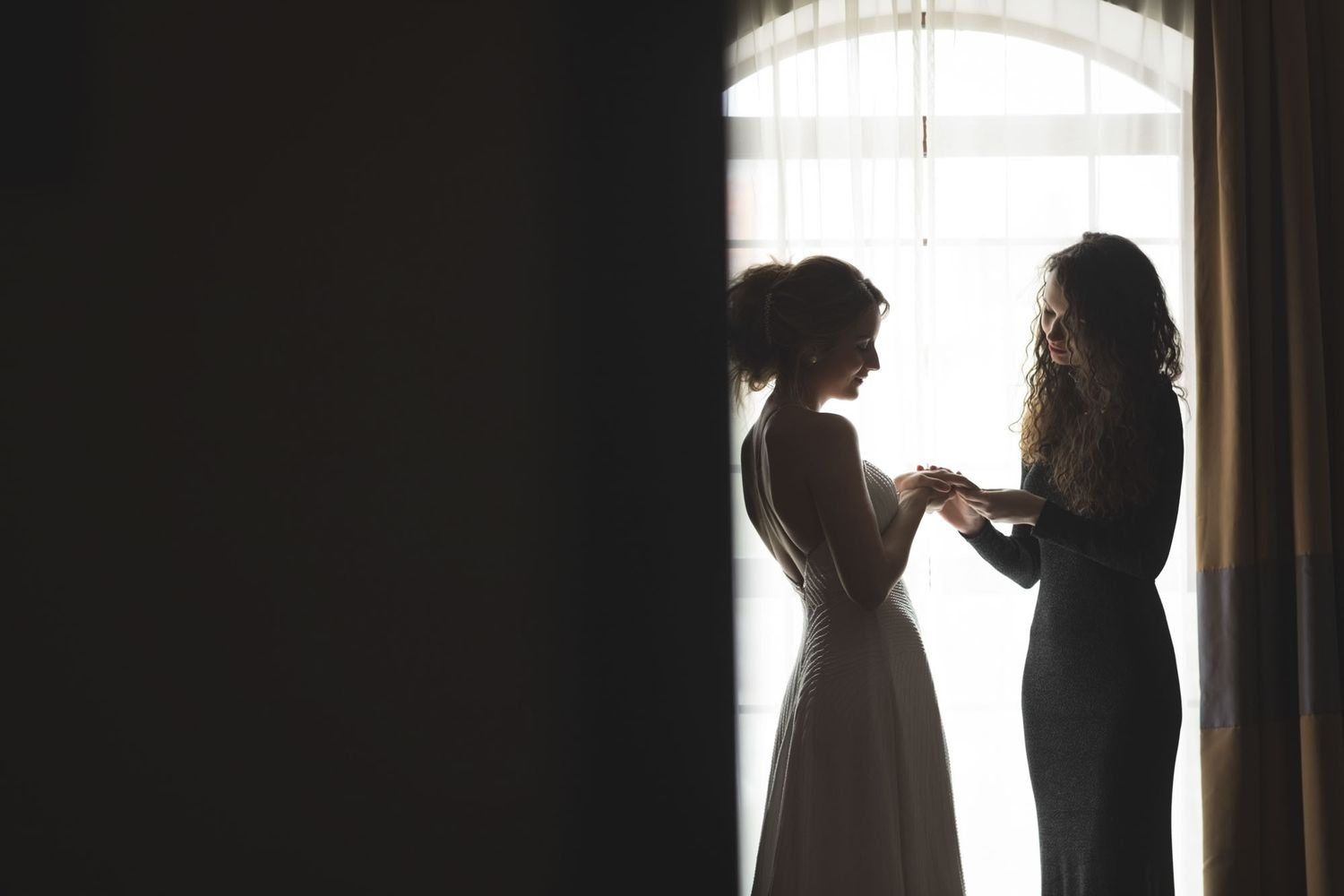 Bride and Bridesmaid looking at engagement ring before wedding in Cork