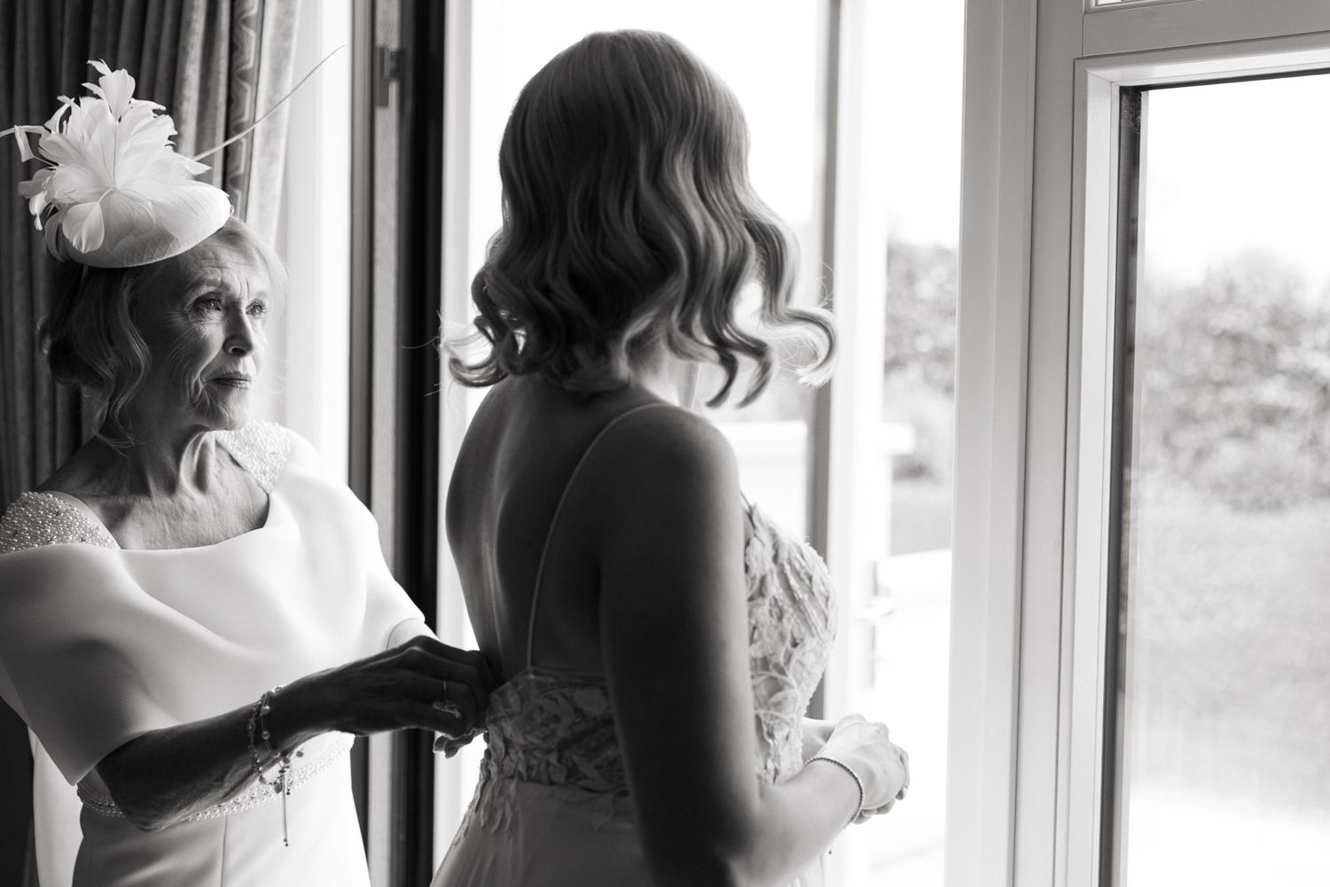 Emotional moment between bride and her Mother while preparing for wedding at Clanard court
