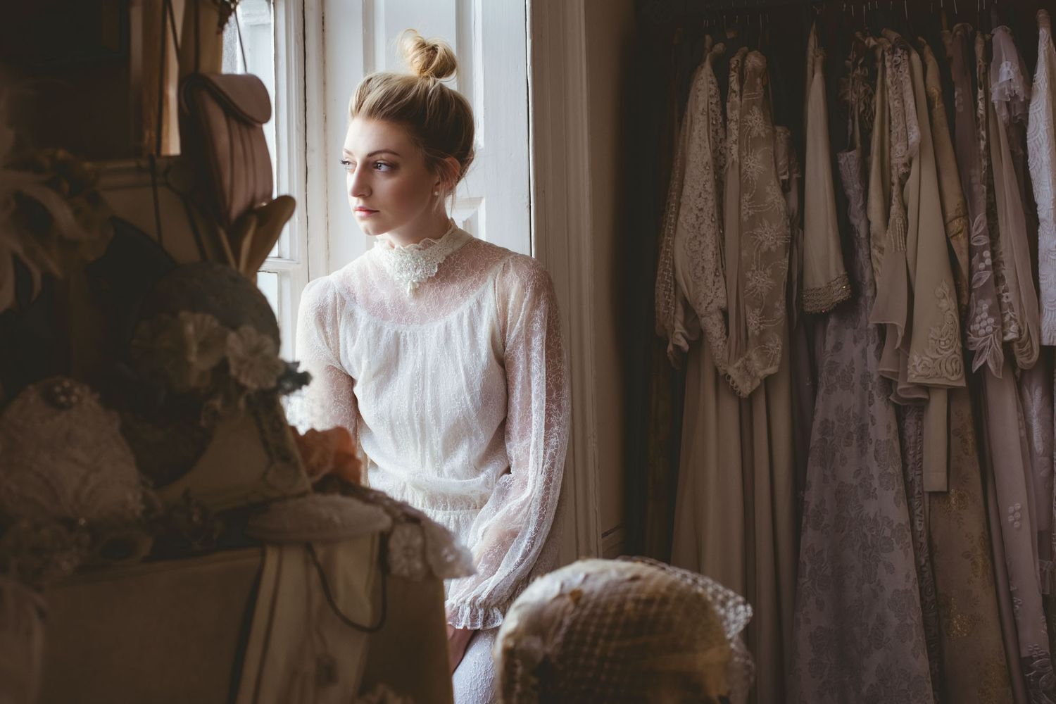 Bride sitting at window before wedding in cork city