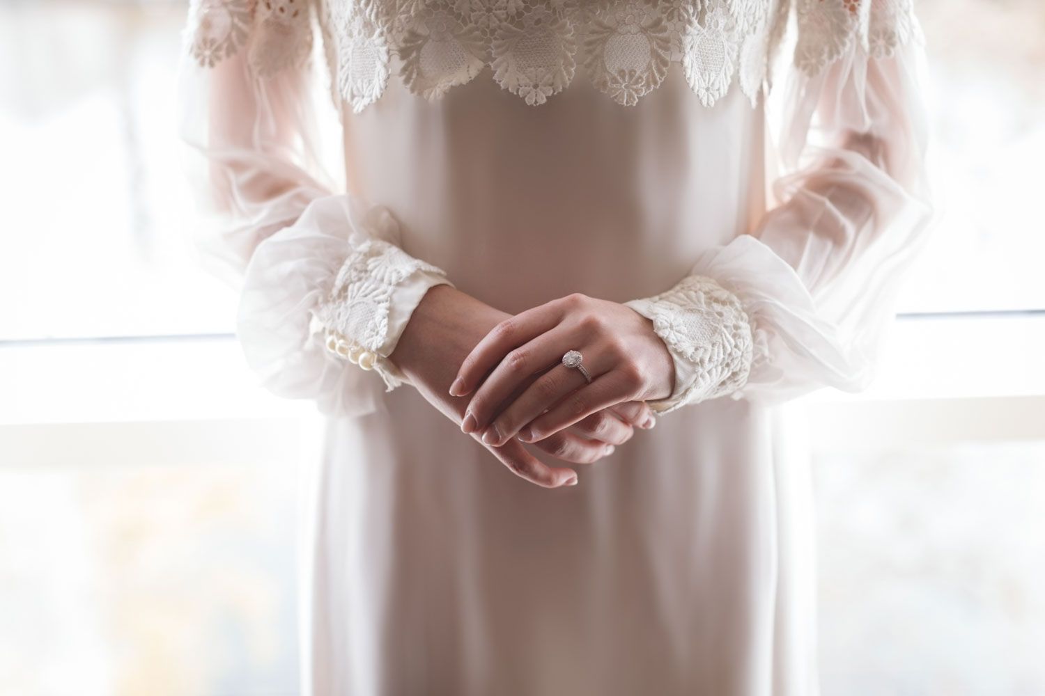 Cork wedding photographer Paul cowhig captures Close-up of bride’s hands and accessories photographed in Kinsale, Cork