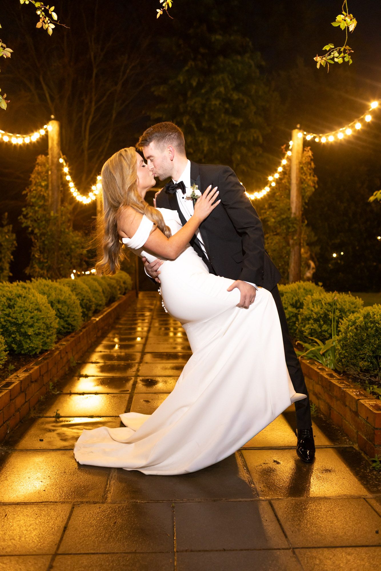 Romantic scene wedding photo of couple kissing at Tinakilly house in wicklow Photographed by Paul Cowhig