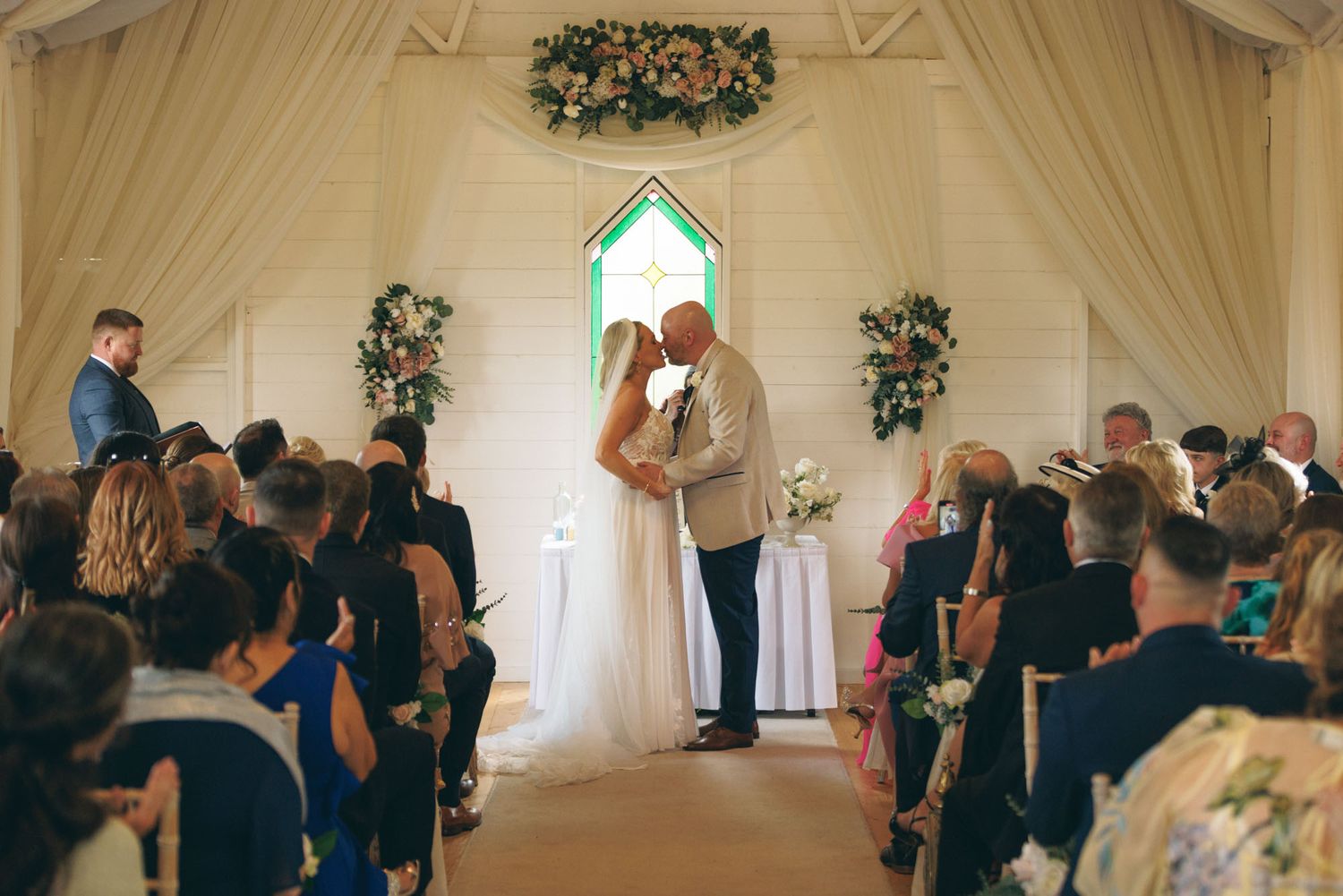 Bride and groom kiss for the first time as a married couple at Clanard Court in Kildare, Ireland