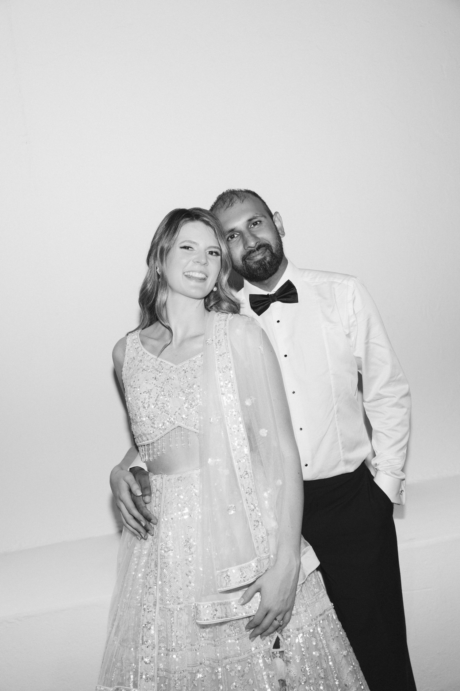 Candid black and white photo series showing joyful moments at wedding reception.