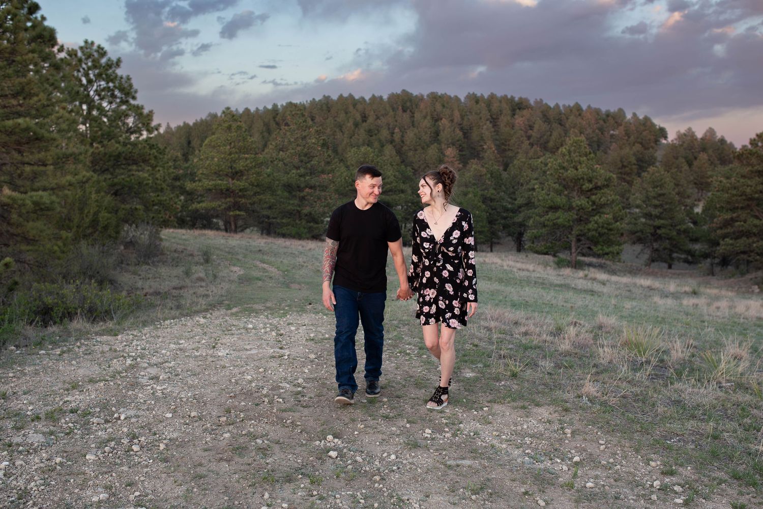 couple exploring the ranch together in the black hills of south dakota.