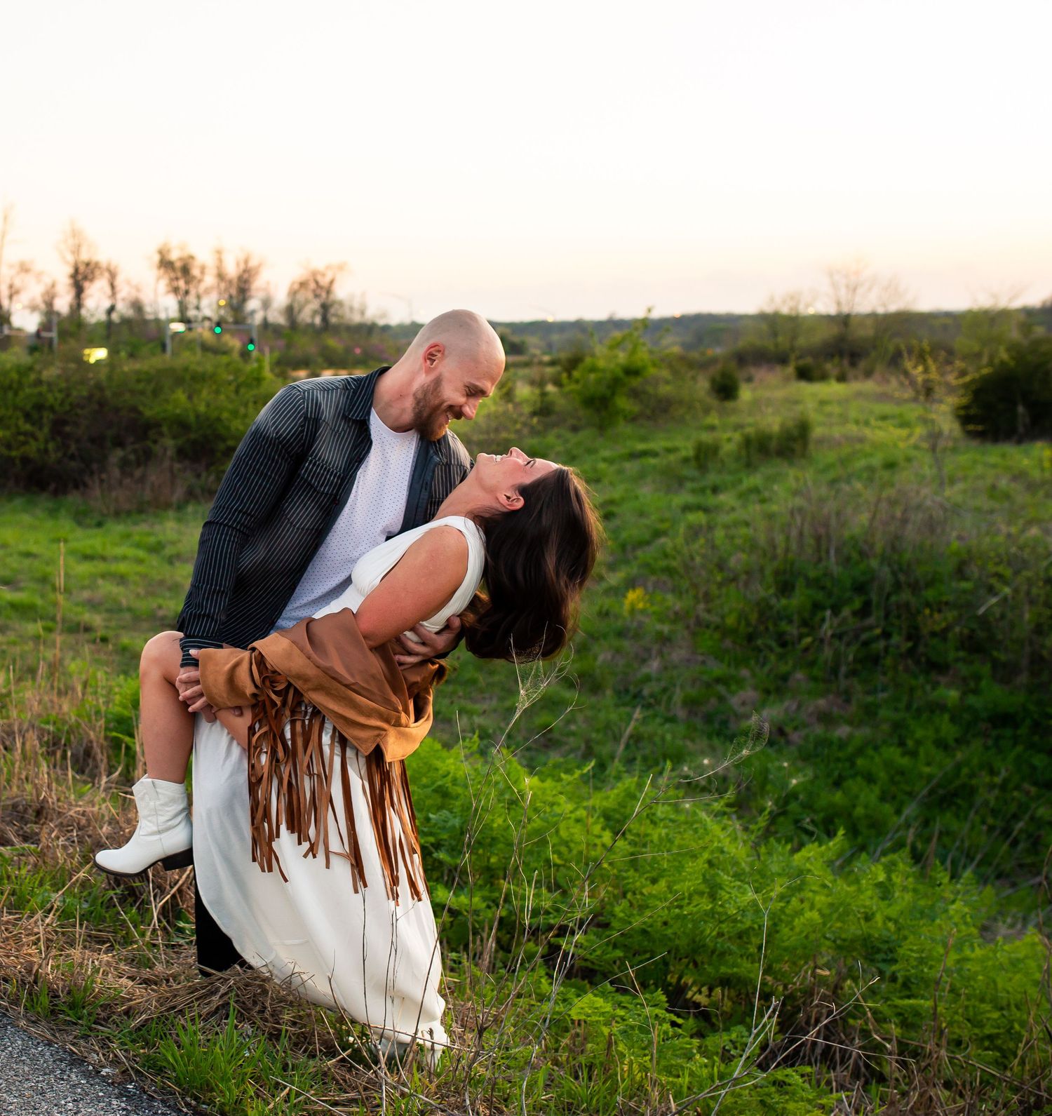 Couple in love in Missouri laughing.